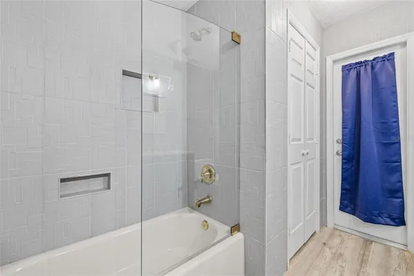 a view of a kitchen with white cabinets