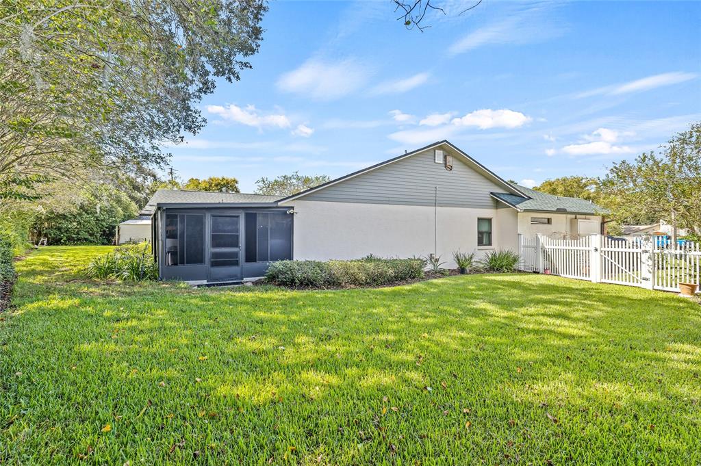 603 Cottage Grove Circle Valrico, FL 33594 - Photo 53 of 60 a view of a yard in front of a house with a large tree