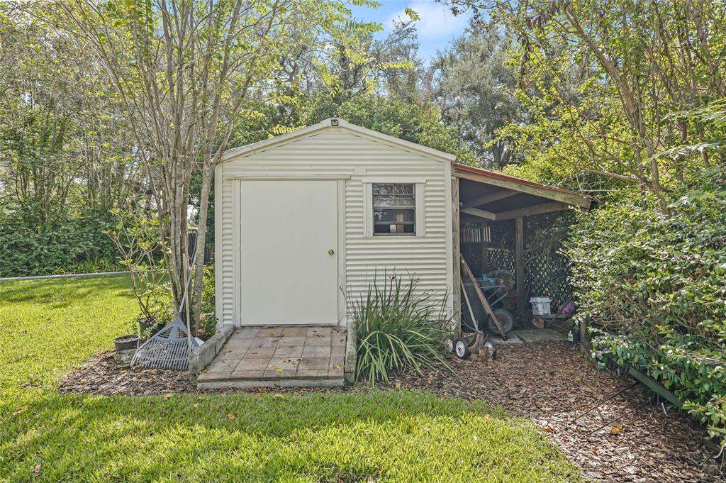 603 Cottage Grove Circle Valrico, FL 33594 - Photo 56 of 60 a front view of a house with garden