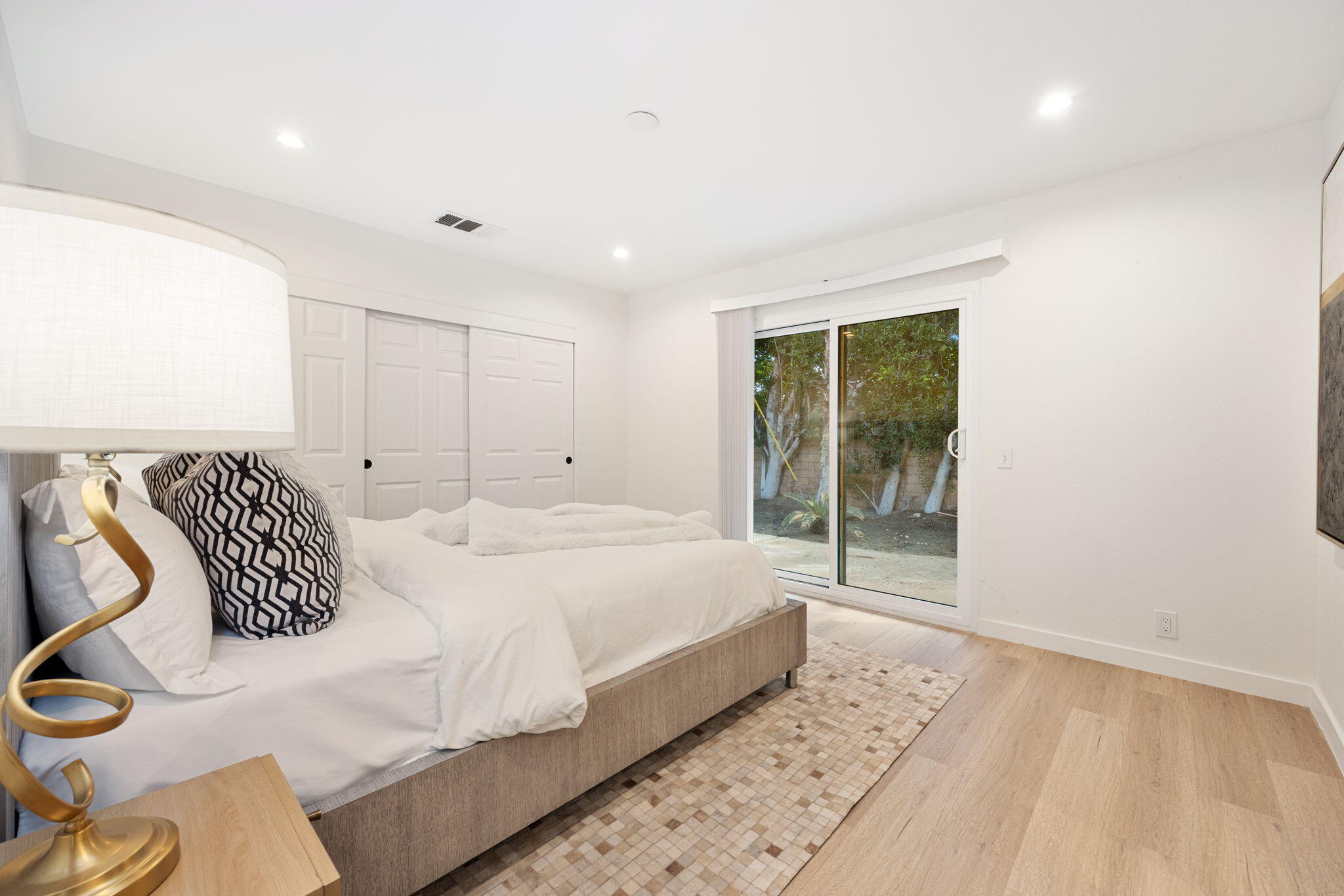 2900 North Cypress Road Palm Springs, CA 92262 - Photo 21 of 48 a bedroom with a bed and wooden floor