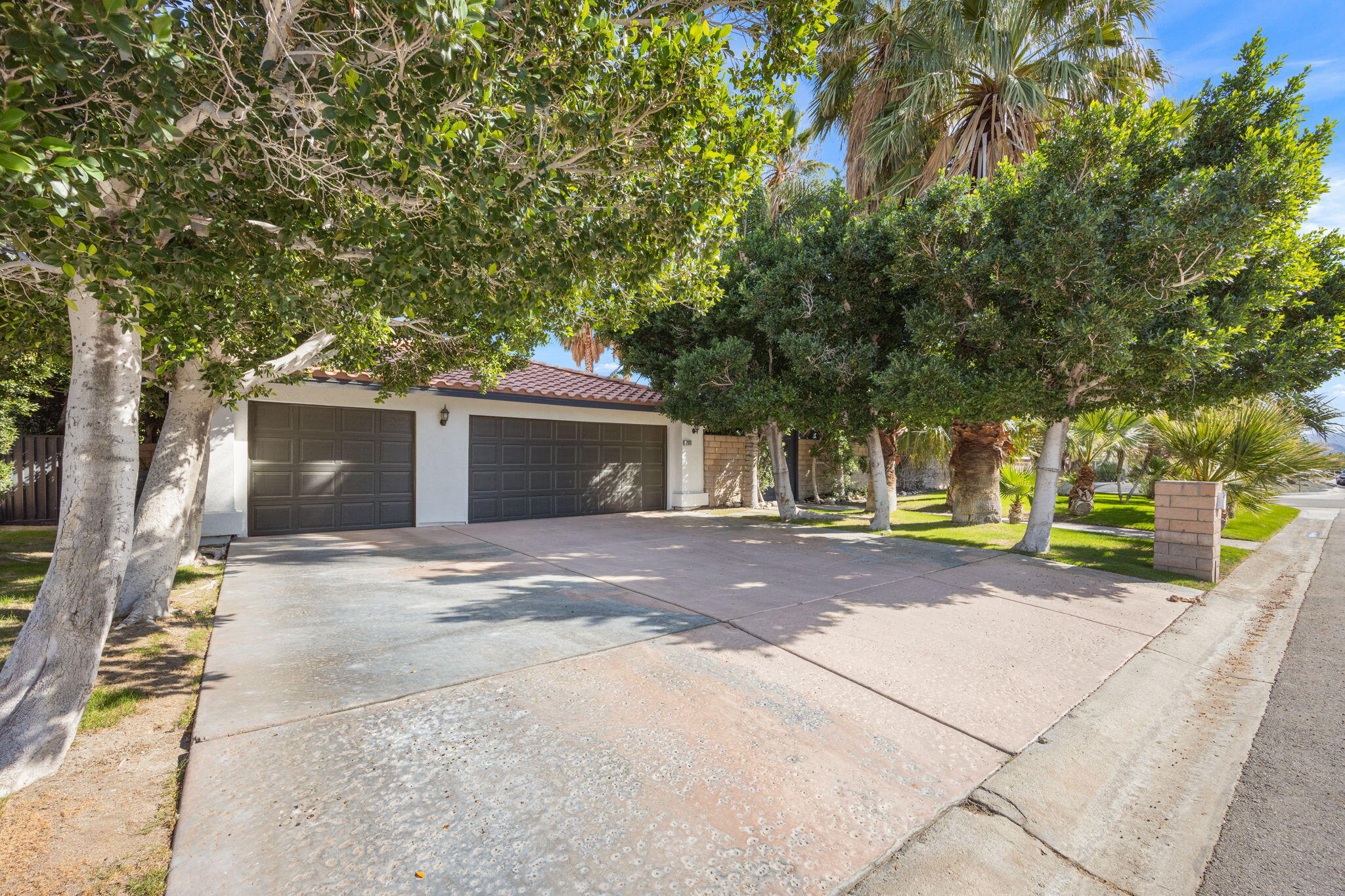 2900 North Cypress Road Palm Springs, CA 92262 - Photo 3 of 48 a front view of a house with a yard and garage