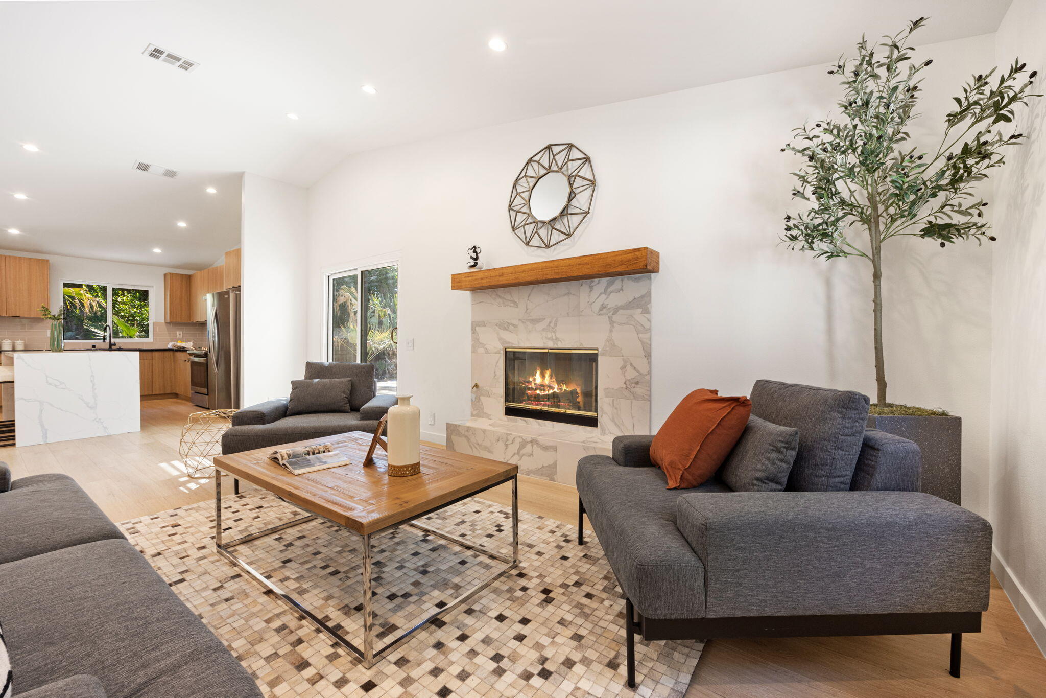 2900 North Cypress Road Palm Springs, CA 92262 - Photo 10 of 48 a living room with furniture a table and a fireplace