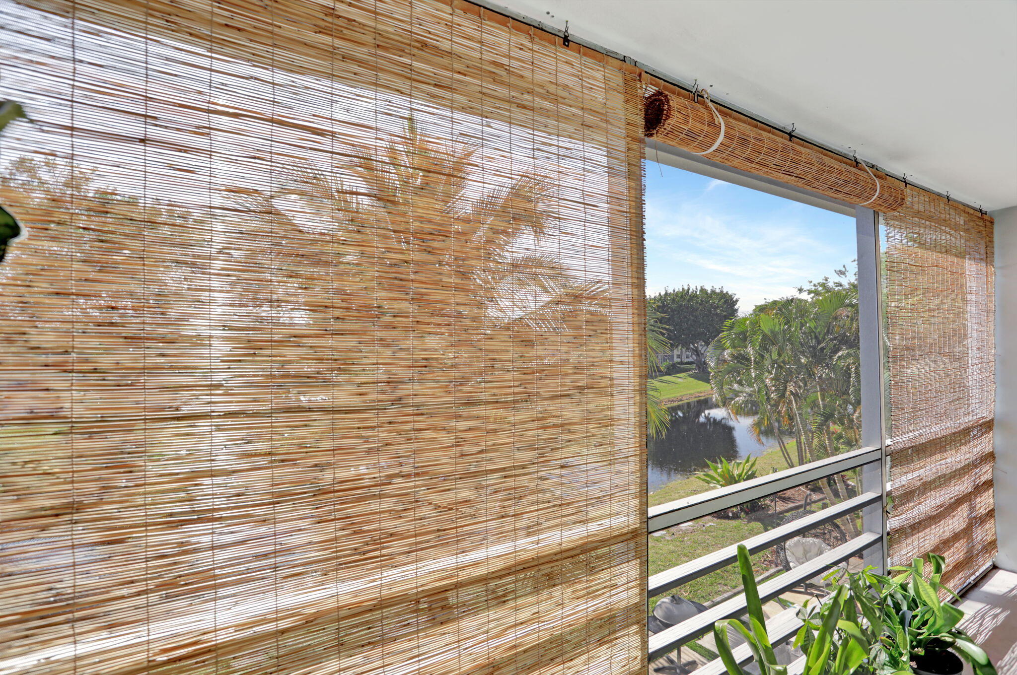 86 Lyndhurst D, Unit D Deerfield Beach, FL 33442 - Photo 13 of 42 a view of a glass door with glass windows