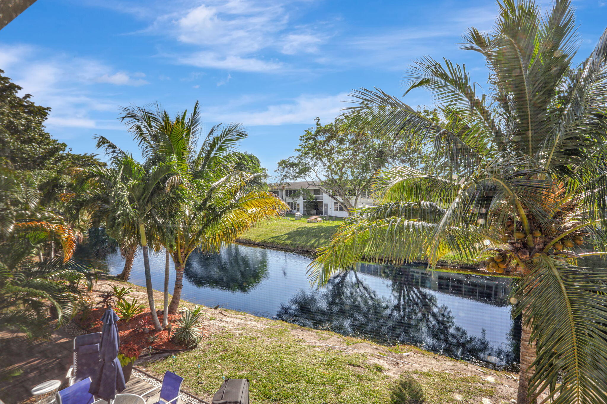 86 Lyndhurst D, Unit D Deerfield Beach, FL 33442 - Photo 14 of 42 a view of a house with a yard
