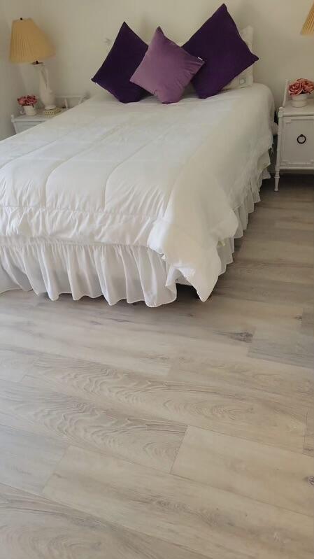 86 Lyndhurst D, Unit D Deerfield Beach, FL 33442 - Photo 17 of 42 a bedroom with a bed and a baby crib