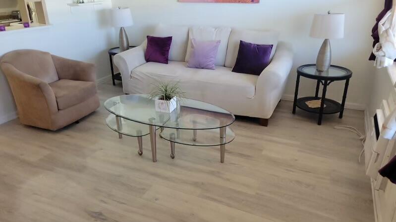 86 Lyndhurst D, Unit D Deerfield Beach, FL 33442 - Photo 18 of 42 a living room with furniture and a rug