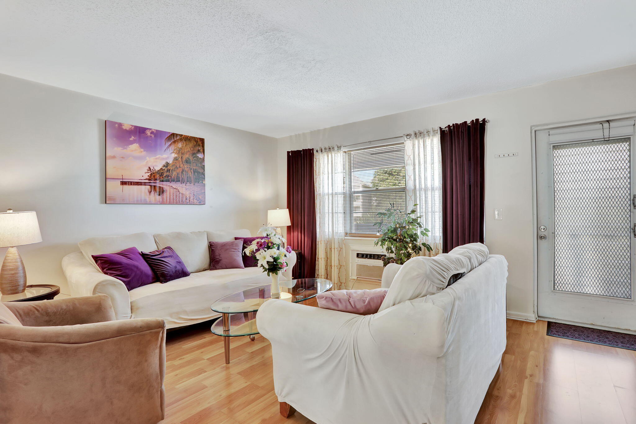 86 Lyndhurst D, Unit D Deerfield Beach, FL 33442 - Photo 3 of 42 a living room with furniture and a large window