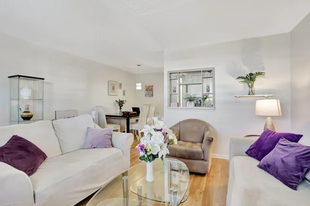 a living room with furniture and a lamp