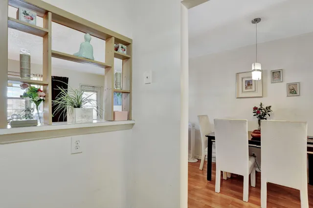 a view of a room with a table and chairs