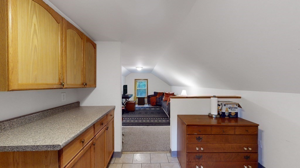 569 Mill Street Worcester, MA 01602 - Photo 15 of 24 a kitchen with a refrigerator and a stove