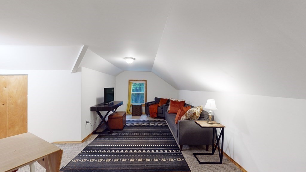 569 Mill Street Worcester, MA 01602 - Photo 20 of 24 a living room with furniture and a rug