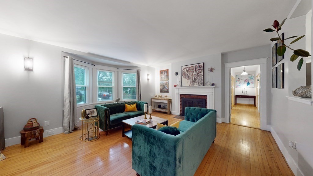 569 Mill Street Worcester, MA 01602 - Photo 2 of 24 a living room with furniture and a fireplace