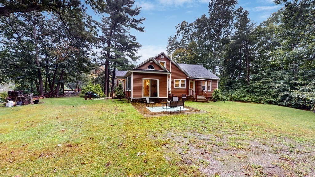 569 Mill Street Worcester, MA 01602 - Photo 22 of 24 a front view of a house with yard and green space