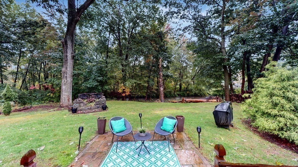 569 Mill Street Worcester, MA 01602 - Photo 23 of 24 a view of backyard with seating area and green space