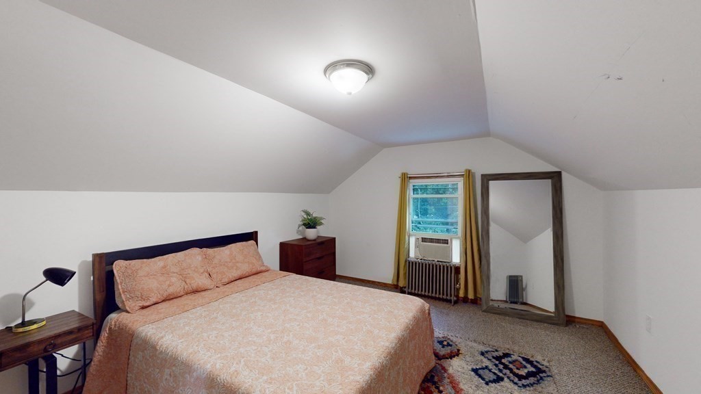 569 Mill Street Worcester, MA 01602 - Photo 9 of 24 a bedroom with a bed and a window