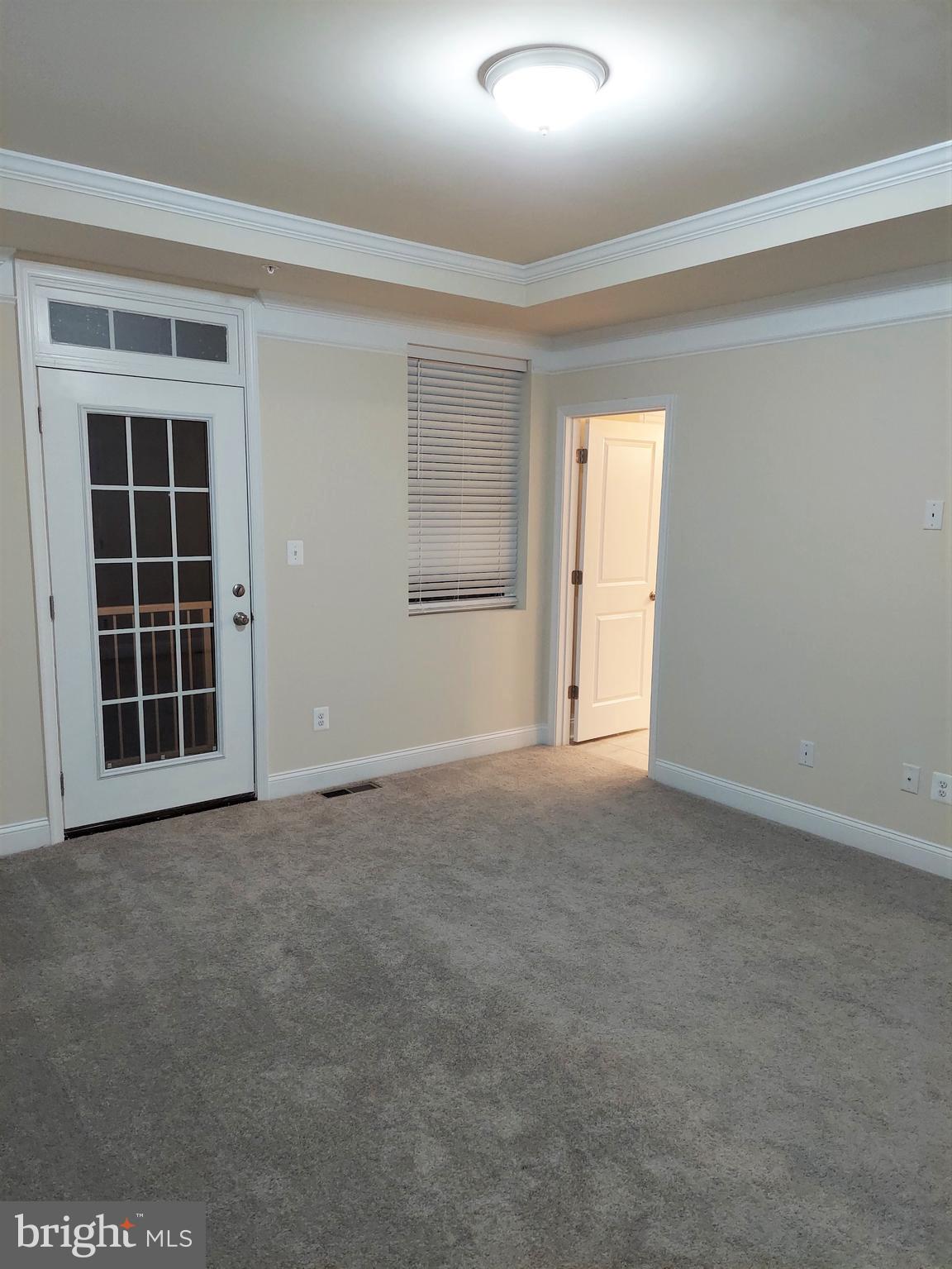 7140 Proclamation Place Frederick, MD 21703 - Photo 17 of 29 Bedroom #1 and access to the deck