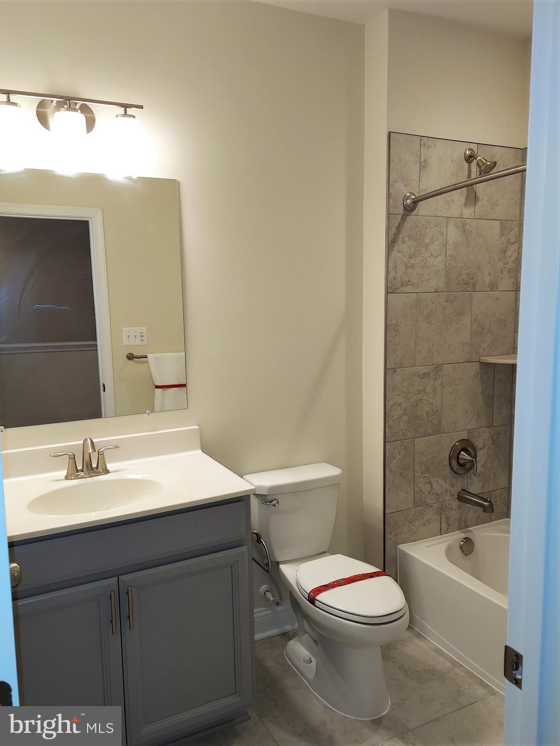 7140 Proclamation Place Frederick, MD 21703 - Photo 26 of 29 Upgraded tiles in hall bathroom