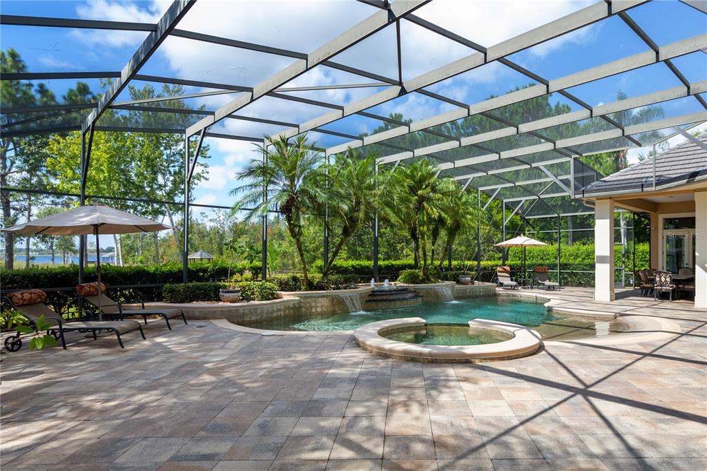 2016 Castelli Boulevard Mount Dora, FL 32757 - Photo 30 of 52 a view of a swimming pool with a patio