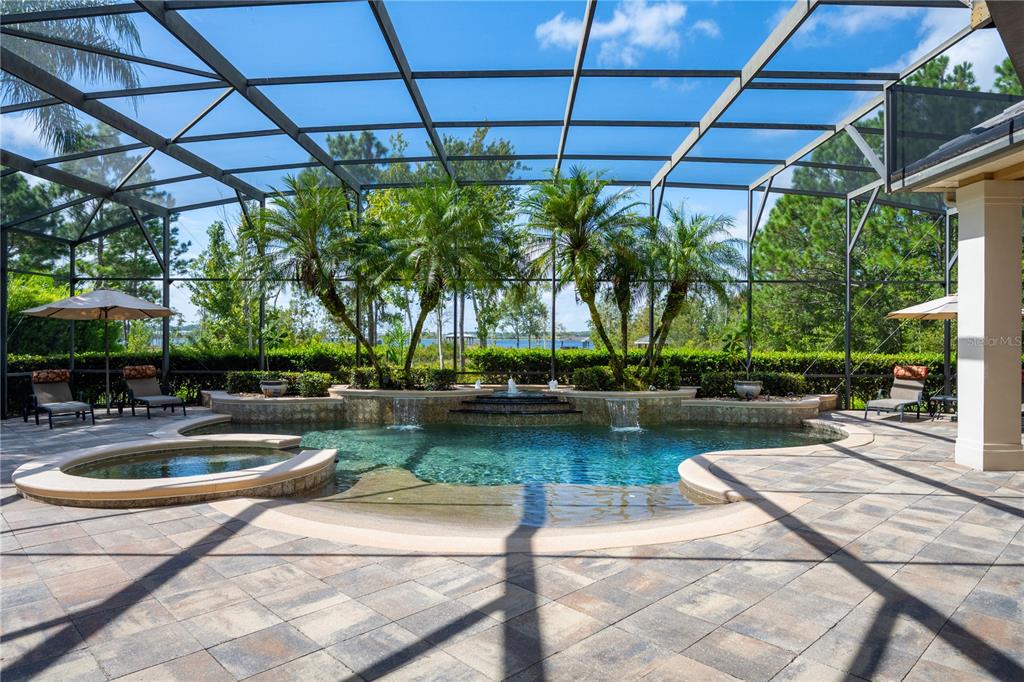 2016 Castelli Boulevard Mount Dora, FL 32757 - Photo 32 of 52 a view of a swimming pool with a patio and a garden