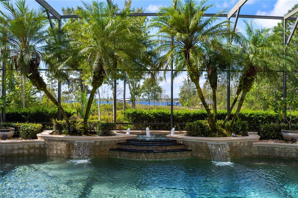 2016 Castelli Boulevard Mount Dora, FL 32757 - Photo 38 of 52 a view of swimming pool with outdoor seating and trees