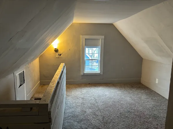 a view of an empty room with windows