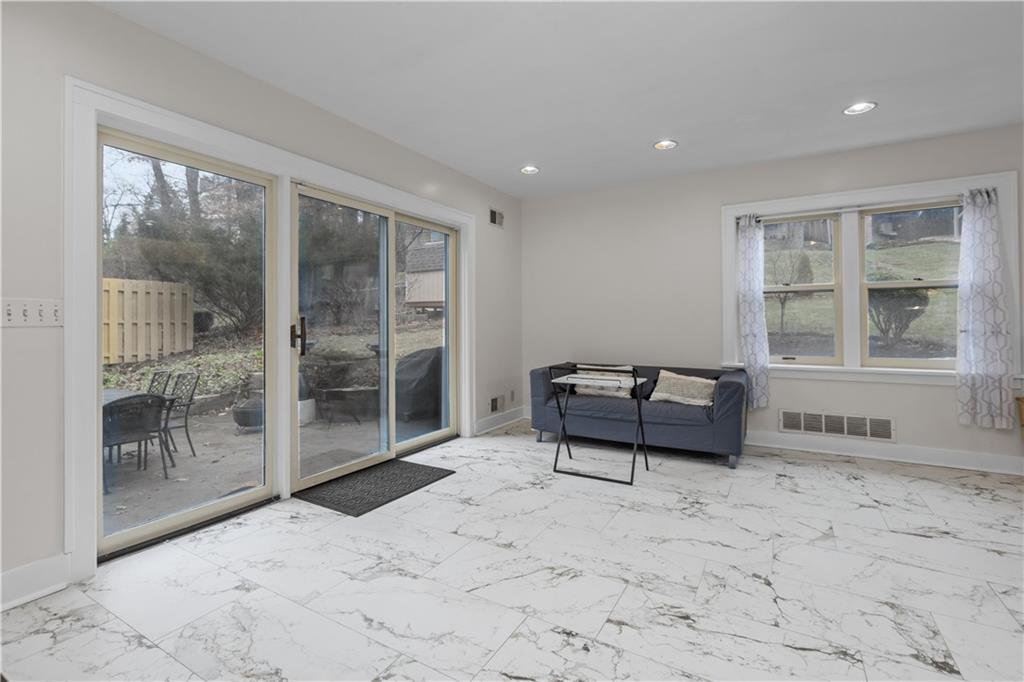 1355 Washington Road Pittsburgh, PA 15228 - Photo 21 of 49 Family room leads to a stone patio.