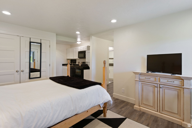 1900 North 100 East Provo, UT 84604 - Photo 37 of 49 Open-concept living space featuring wood-finish flooring, recessed lighting, and a neutral color palette