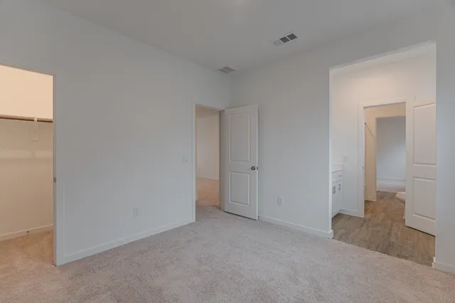 a view of a backyard with table and chairs under an umbrella