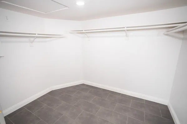 a view of a patio with table and chairs and potted plants