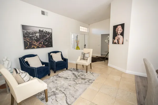 a living room with furniture and a couch