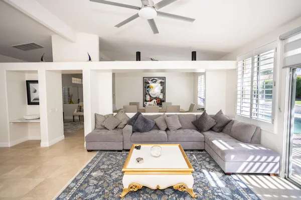 a kitchen with stainless steel appliances kitchen island granite countertop a stove a sink a refrigerator and a refrigerator