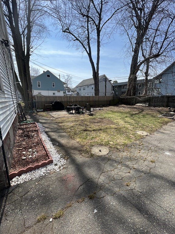 68-70 Suffolk Street Springfield, MA 01109 - Photo 13 of 19 a view of a yard with large trees