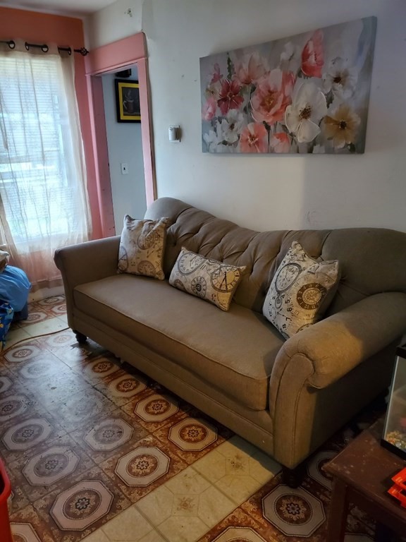 68-70 Suffolk Street Springfield, MA 01109 - Photo 15 of 19 a living room with furniture and a window