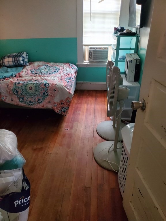 68-70 Suffolk Street Springfield, MA 01109 - Photo 16 of 19 a bedroom with furniture and a fireplace