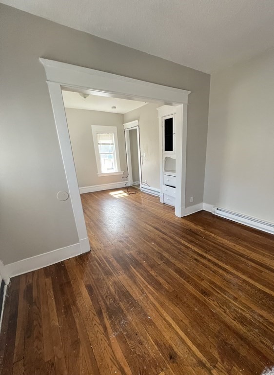 68-70 Suffolk Street Springfield, MA 01109 - Photo 5 of 19 wooden floor in an empty room with a window