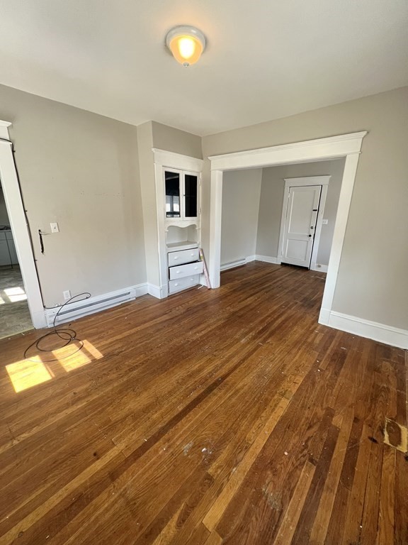 68-70 Suffolk Street Springfield, MA 01109 - Photo 6 of 19 a view of empty room with wooden floor
