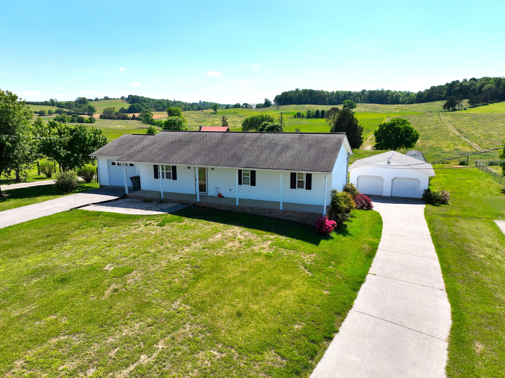 1691 Mullins Road Russellville, TN 37860 - Photo 1 of 23 an aerial view of a house with swimming pool and garden