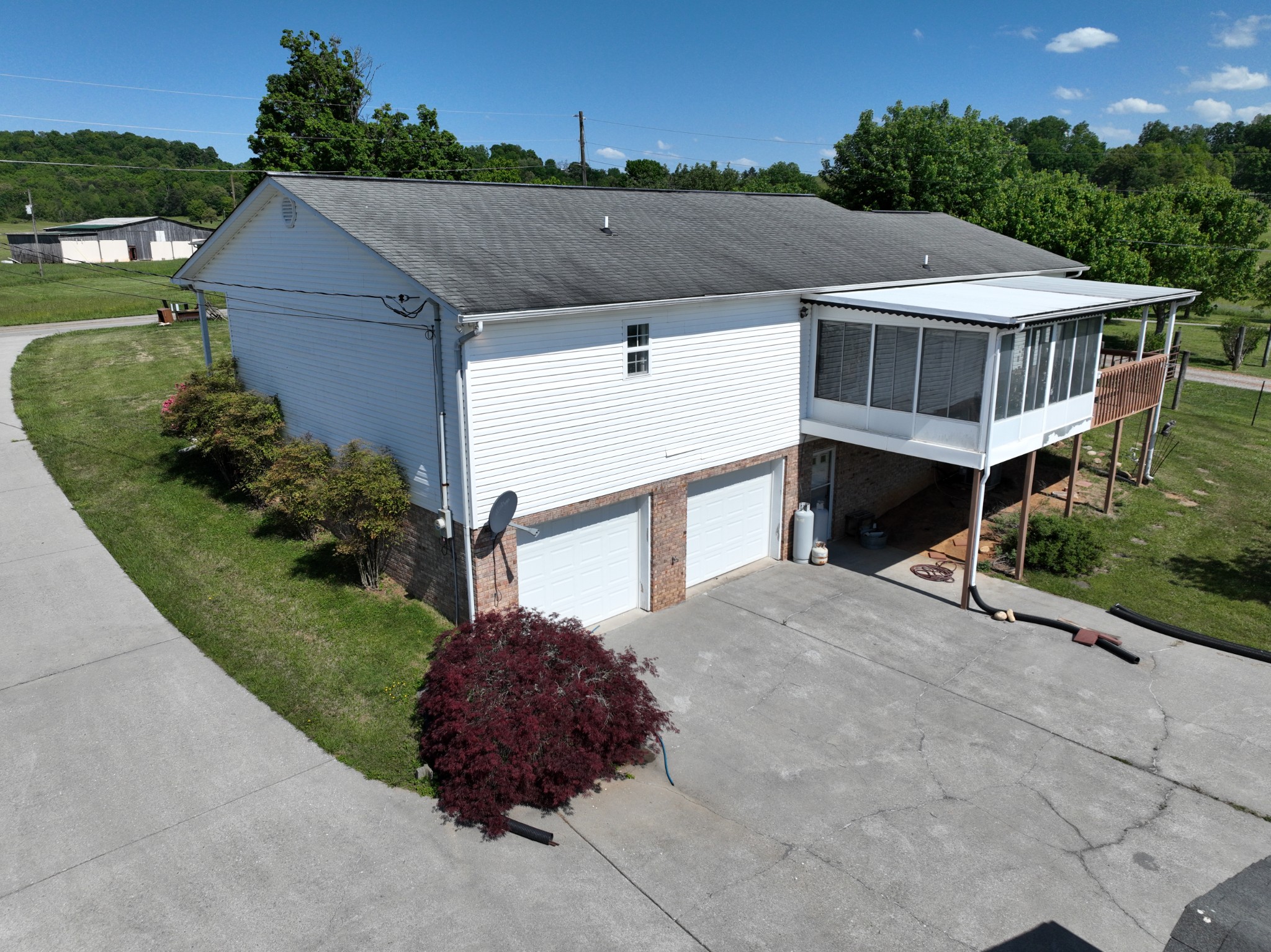 1691 Mullins Road Russellville, TN 37860 - Photo 22 of 23 an aerial view of house with yard and trees in the background