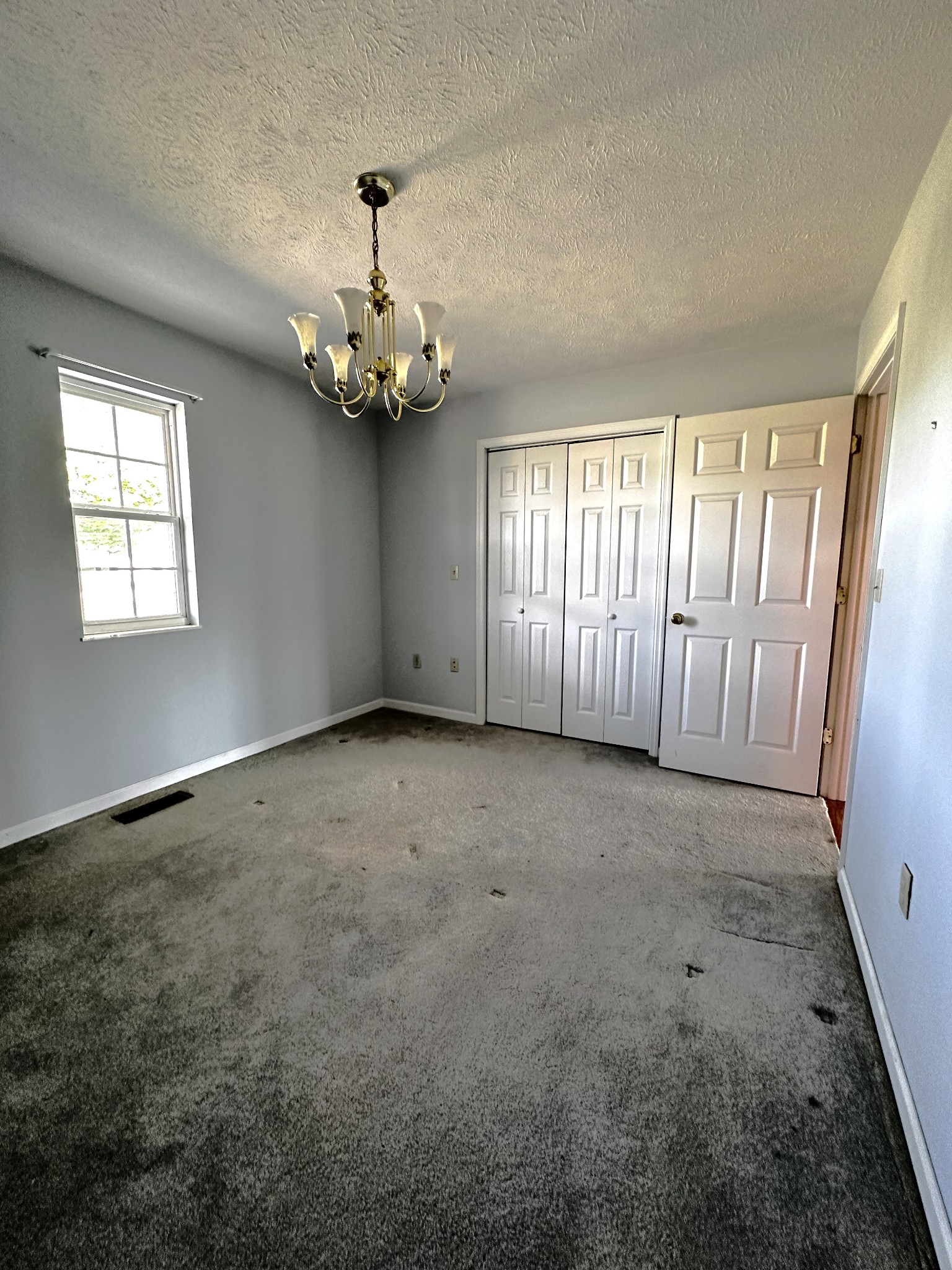 1691 Mullins Road Russellville, TN 37860 - Photo 9 of 23 an empty room with windows and entrance