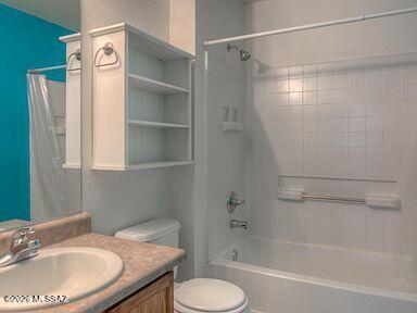 3248 West Treece Place Tucson, AZ 85742 - Photo 11 of 17 a bathroom with a granite countertop sink toilet and shower