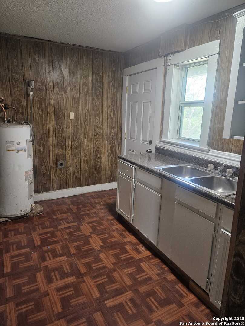 541 Hammond Avenue, Unit 4 San Antonio, TX 78210 - Photo 3 of 4 a room with a sink and cabinets