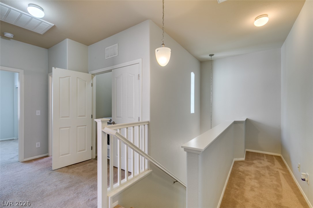 8937 Caledon Ridge Court Las Vegas, NV 89149 - Photo 28 of 43 A well-lit landing provides access to rooms and showcases a practical layout.