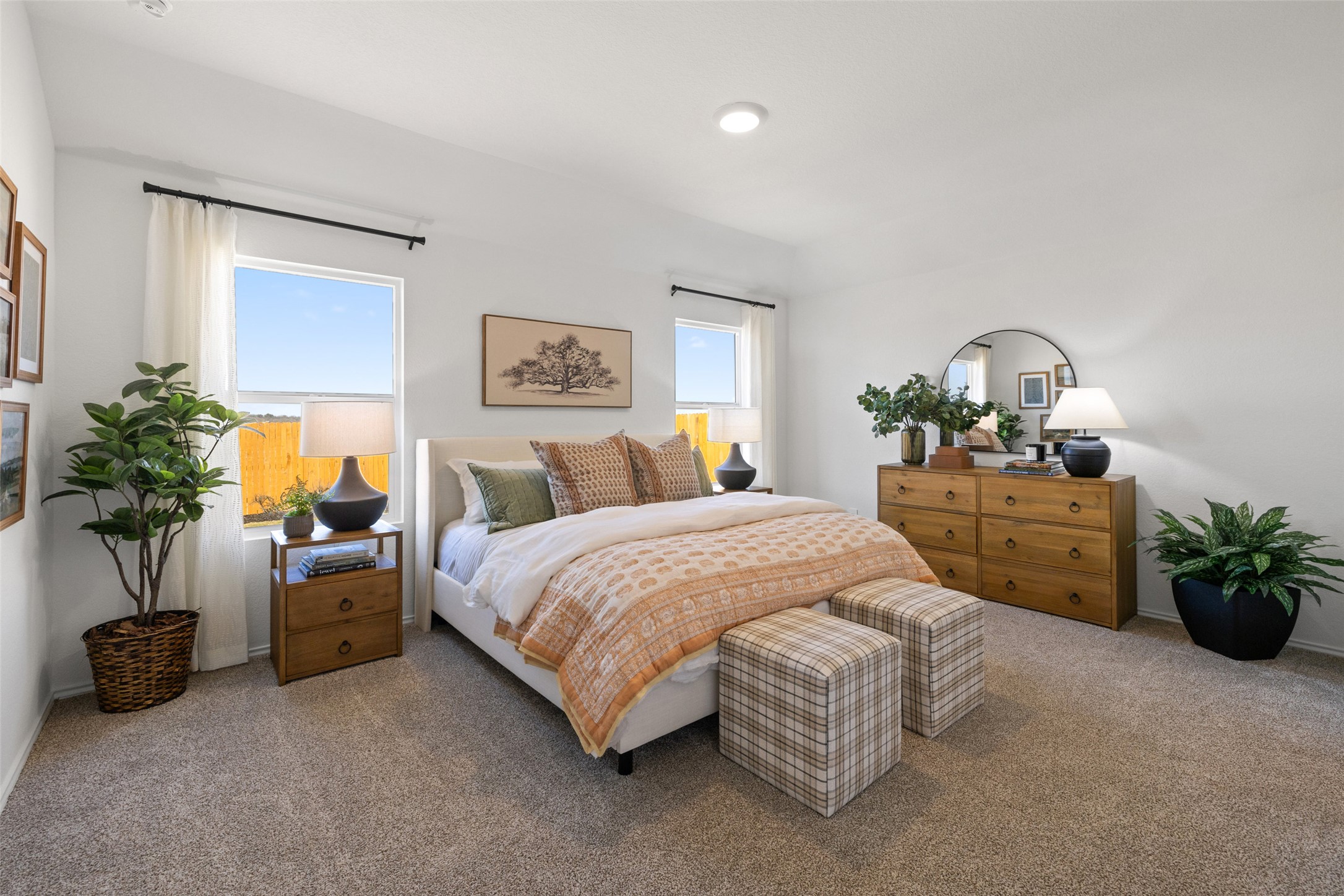 879 Arnold Loop Kyle, TX 78640 - Photo 20 of 33 a spacious bedroom with a bed and a potted plant