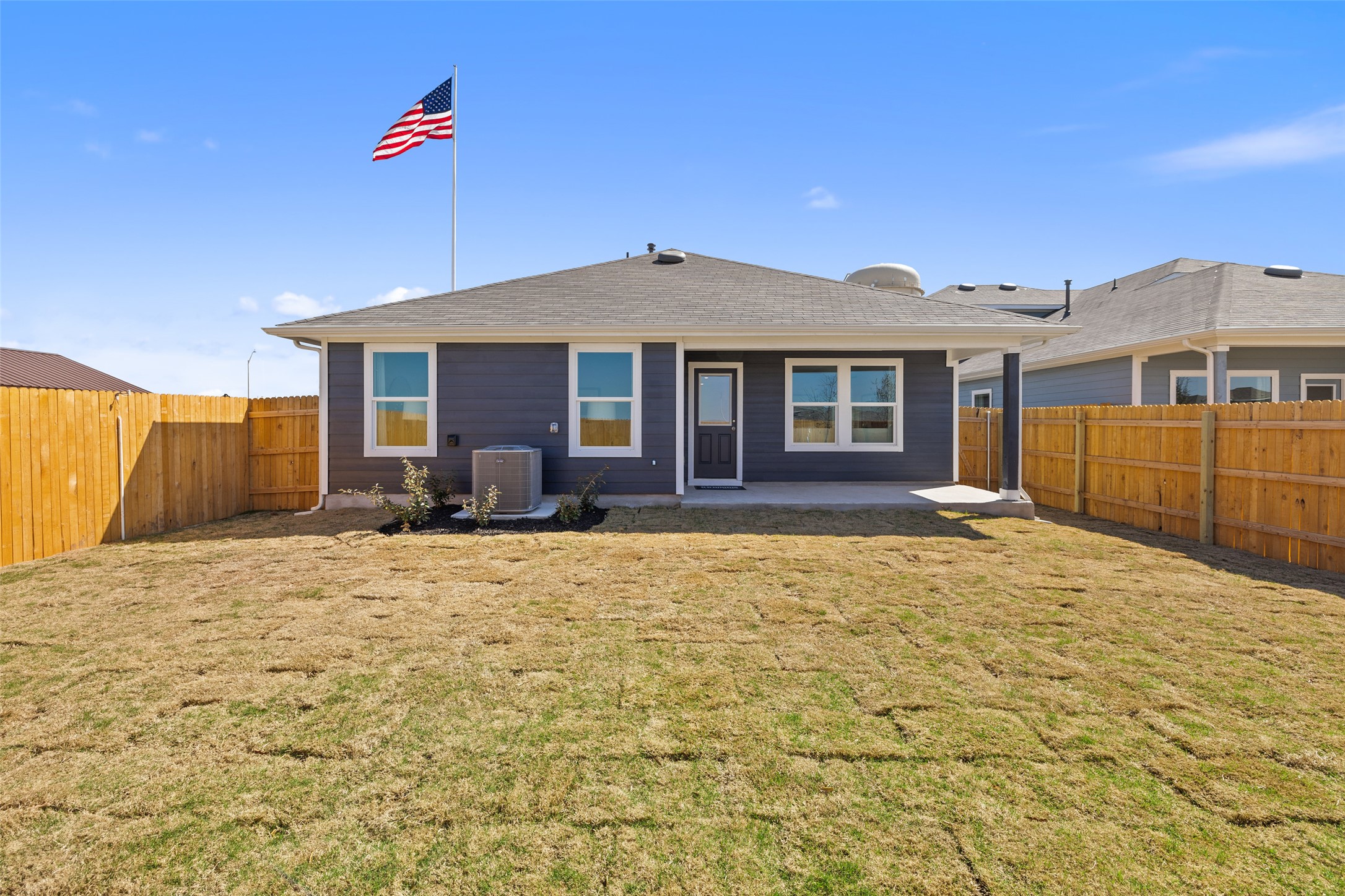 879 Arnold Loop Kyle, TX 78640 - Photo 33 of 33 a front view of a house with a yard