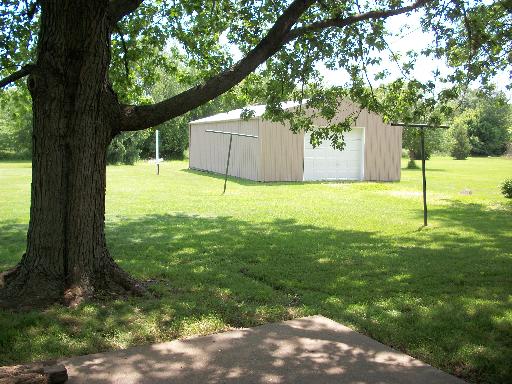 4212 Sandy Bluff Road Plano, IL 60545 - Photo 14 of 15 a backyard of a house with lots of green space