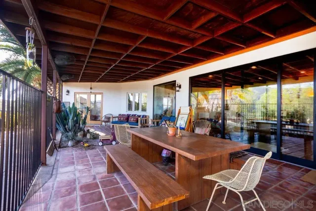 a view of swimming pool with outdoor seating