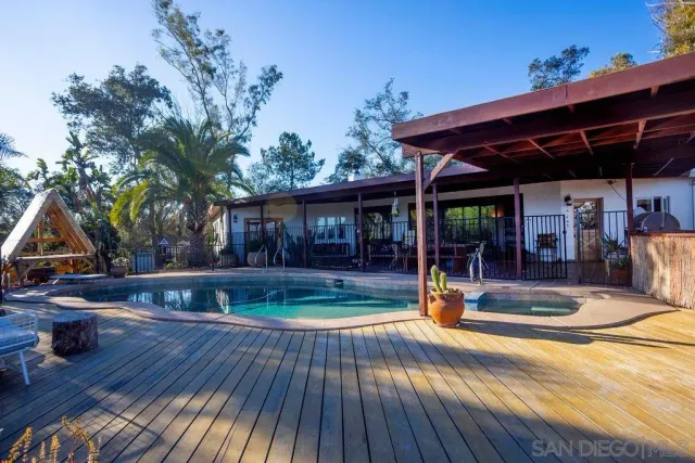 a view of swimming pool with outdoor seating
