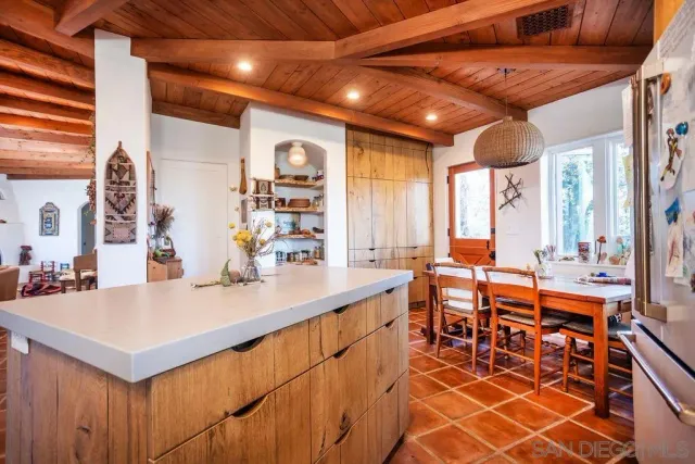 a room with lots of counter top space and furniture