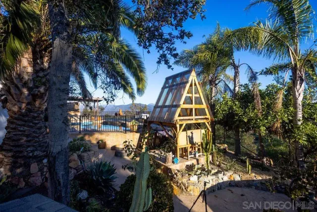 a view of a tree with houses