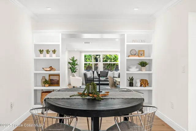 a bedroom with furniture and a large window